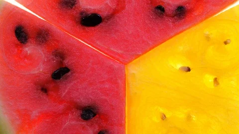 Flat-lay view of three slices of red and yellow watermelon rotating in 4K 스톡 동영상 89869353