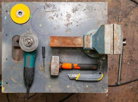 Flat lay view of a workbench with a set of tools consisting of a large heavy  Stock Photos