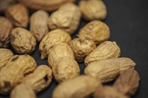 Flat lay wave shape of roasted unsalted peanuts, peanuts in skin and peanuts  Stock Photos