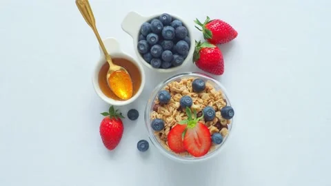 Flat Lay White breakfast seasonal berries honey Stock Footage 190024949
