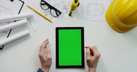 Flat lay of the white desk with constructor's stuff on which male hands Video stock 96039849