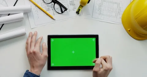 Flat lay of the white desk with constructor's stuff on which male hands Video stock 96041132