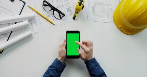 Flat lay of the white desk with constructor's stuff on which female hands Stock Footage 96043873