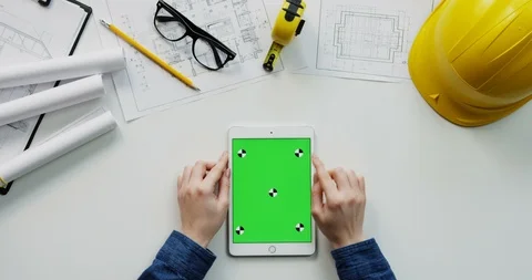 Flat lay of the white desk with constructor's stuff on which female hands Stock Footage 96045101