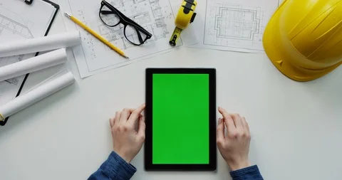 Flat lay of the white desk with constructor's stuff on which female hands Stock Footage 96045818