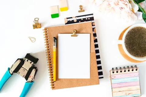 Flat lay of white working table background with cup of coffee. Top view scrap Stock Photos