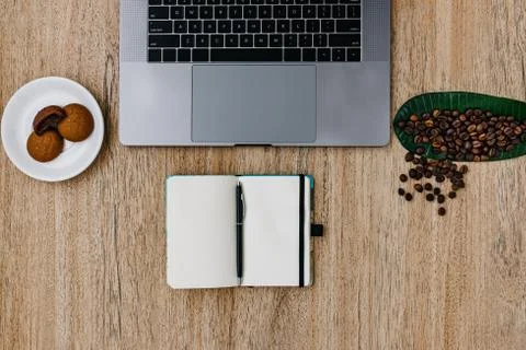 Flat lay of the workplace. Freelance work laptop smartphone and note pad Stock Photos