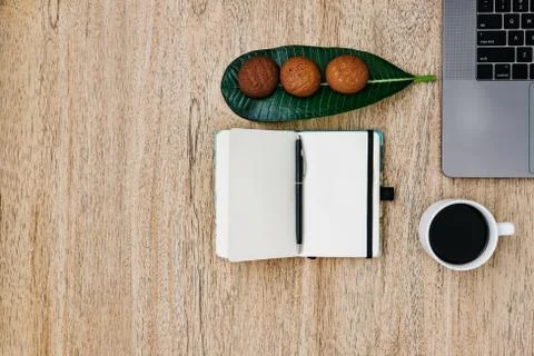 Flat lay of the workplace.  work laptop smartphone and note pad. Morning coffee Stock Photos