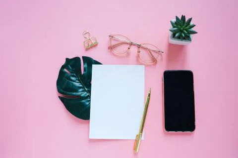 Flat lay of workspace desk, minimal stationery with smartphone and notebook,  Stock Photos