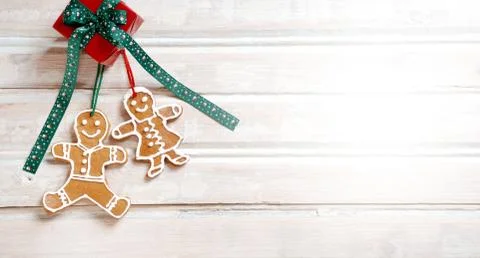 Flat lay xmas gingerbread man on wooden boards. Stock Photos