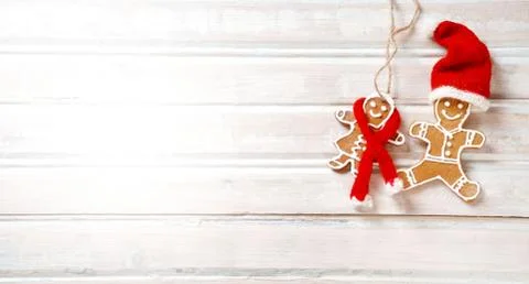 Flat lay xmas gingerbread man on wooden boards. Stock Photos
