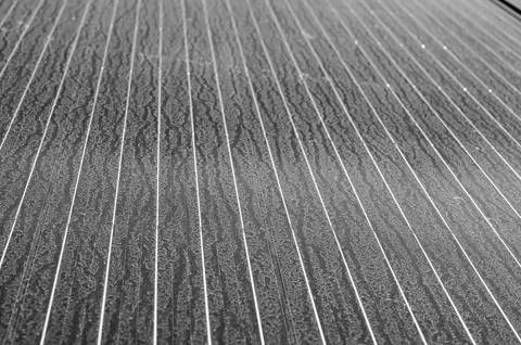 Flat laying solar panel with dust covering sections and reducing efficiency. Stock Photos