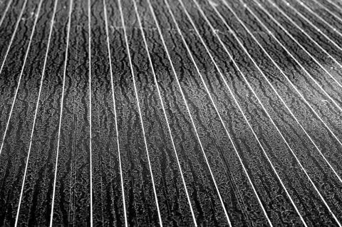 Flat laying solar panel with dust covering sections and reducing efficiency. Stock Photos