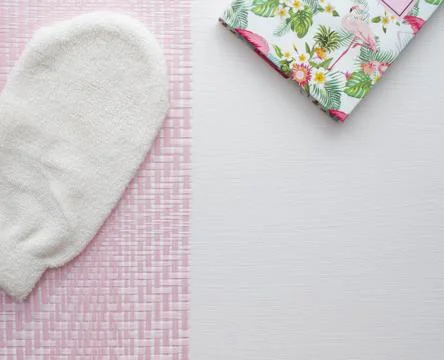 Flat layout bath with notebook on white and pink napkin. Stock Photos