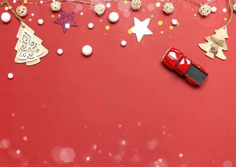 Flat layout, Christmas background with highlights, snowballs, red car. Stock Photos