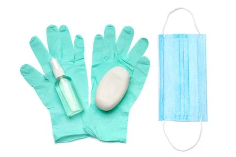 Flat layout of hygiene items - latex gloves, mask and hand sanitizer or liquid Stock Photos