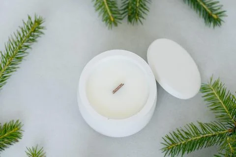 Flat layout. Top view of wax candles in Plaster Pot with Lid. Fir Branches. Stock Photos