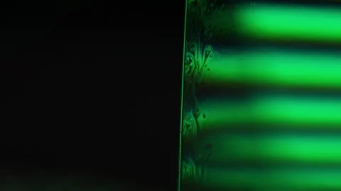 Flat liquid surface, fantastic reflection, black and green Stock Footage 298714294