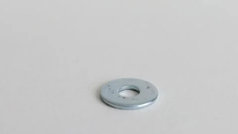 Flat Metal Washers on White Background Close Up Industrial Hardware Vídeo Stock 333773696