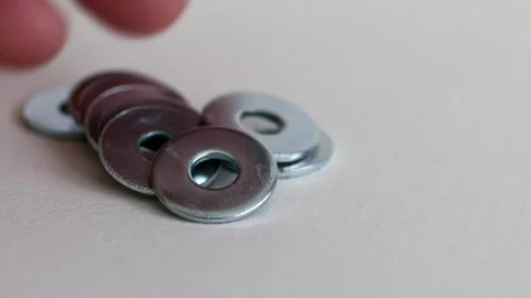 Flat Metal Washers on White Background Close Up Industrial Hardware Set Vídeo Stock 333773878