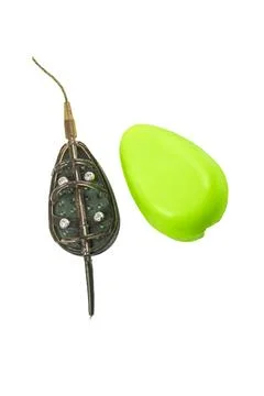 A flat method rig for carp fishing is displayed, featuring a weighted feeder  Stock Photos