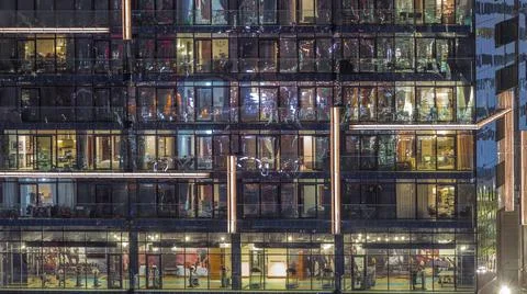 Flat night panorama of multicolor light in windows of multistory buildings ae Stock Photos