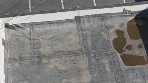 Flat old broken rooftop from water raining damage needing repair maintenance Stock Footage 343659192