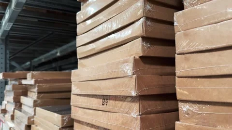 Flat Pack Cardboard Boxes Stacked on Warehouse Shelves Close Up Stock Footage 342890973