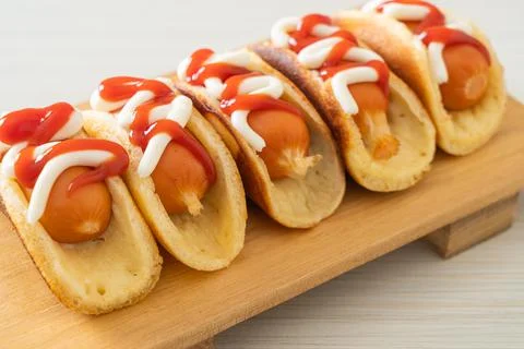 Flat pancake roll with sausage Stock Photos