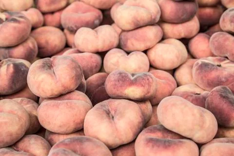 Flat peaches as a background Stock Photos