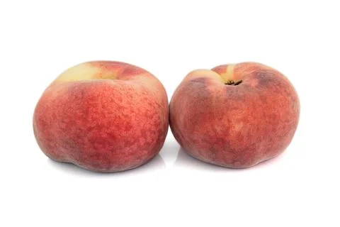 Flat peaches isolated on white background Stock Photos