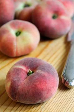 Flat peaches Stock Photos