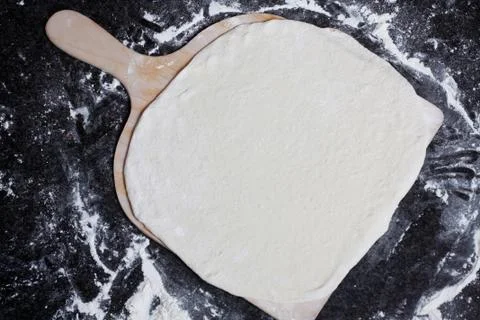 Flat pizza dough Stock Photos