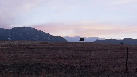 Flat plane with mountains in the background during sunset Stock Footage 113200153