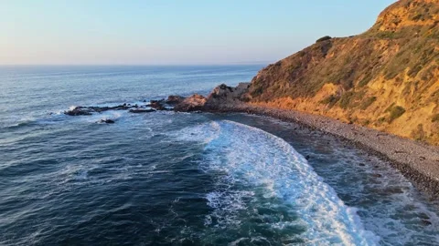 Flat Rock Beach aerial shot at golden hour Stock Footage 310046010