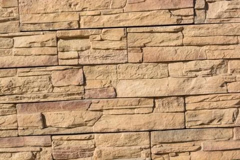 Flat rocks layered to form a solid wall Stock Photos