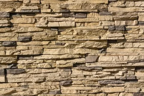 Flat rocks layered to form a solid wall Stock Photos