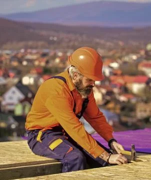 Flat roof installation. Roofer constructing new roof. Construction building 스톡 사진