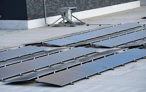 Flat roof solar panel system on the roof of a building Stock Photos