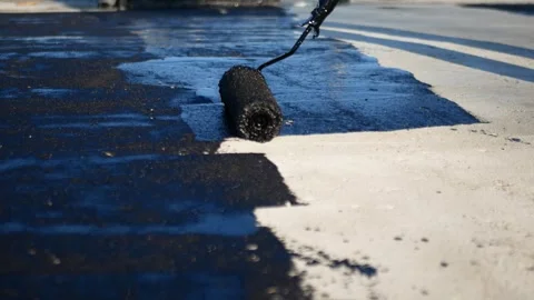 Flat roof waterproofing preparation using mastic primer close up Video stock 292935644