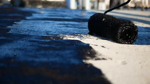 Flat roof waterproofing preparation using mastic primer close up Video stock 292935680