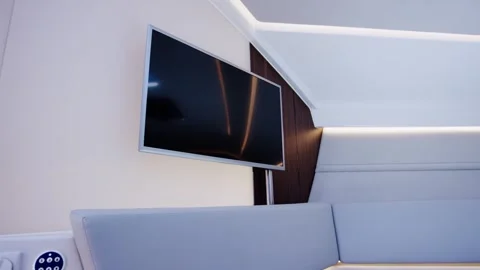 Flat Screen Television on Wall of Modern Yacht Lounge, Leather Sofa, Wide Shot Stock Footage 340336791