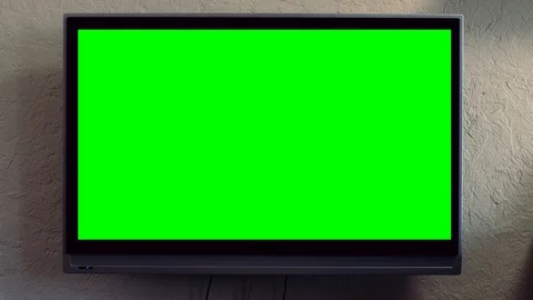 Flat screen TV with green screen composited. TV or television - green screen - Stock Footage