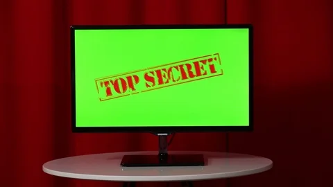 Flat screen TV. Standing on a white table. Green screen. Top secret. Red Vídeos de archivo 103182045
