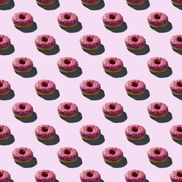 Flat seamless pattern of pink donuts on a warm background Stock Photos