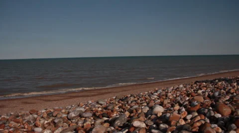 Flat Seas in Sun on Shingle Stock Footage 34467087