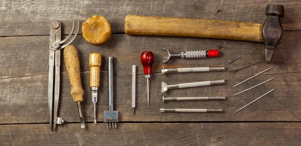 Flat set of leather tool kit for beginners. Old retro instrument for leather Stock Photos