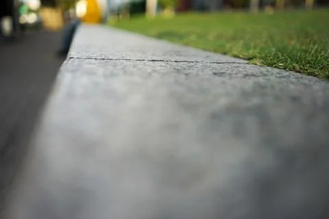 Flat stone and grass Stock Photos