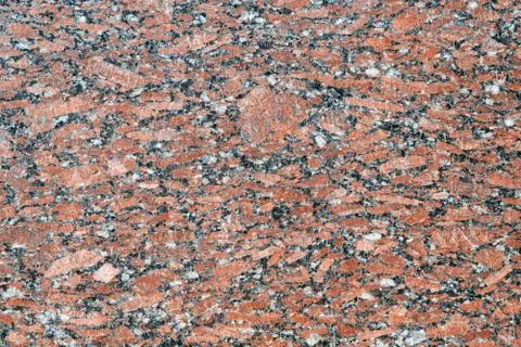 The flat surface of a natural marble or brown granite slab. Stock Photos