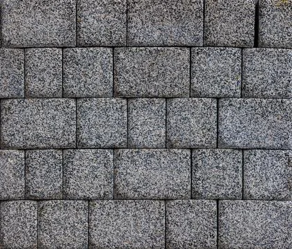 Flat texture and full-frame background of gray cuboid brick pavement Stock Photos
